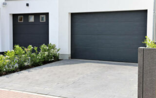 Two Modern New Garage Doors (sectional Doors) In A Residential District